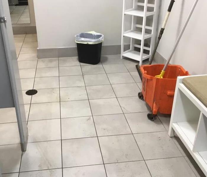 water damage on tile bathroom floor