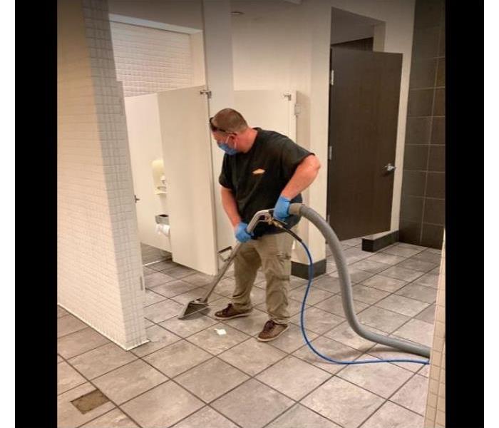 male employee extracting after commercial loss