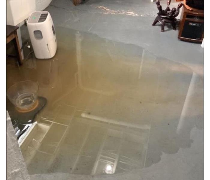 standing water on concrete floor in basement