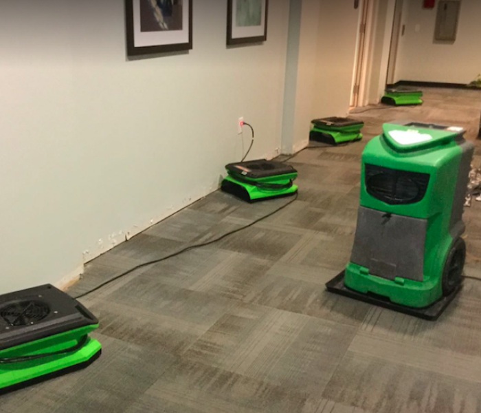equipment set on carpet hallway of commercial facility