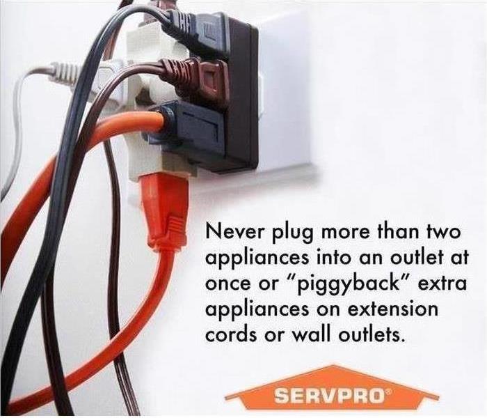 multiple plugs in outlet with servpro logo and tip