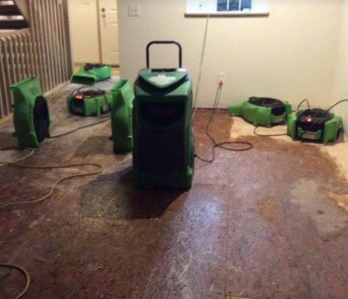 equipment set on wooden boards to dry out water damage